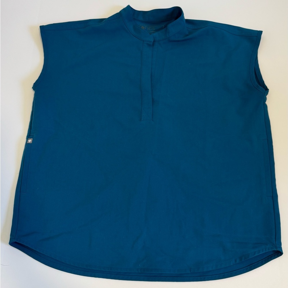 FIGS Rafaela oversized scrub top in a deep teal color size M